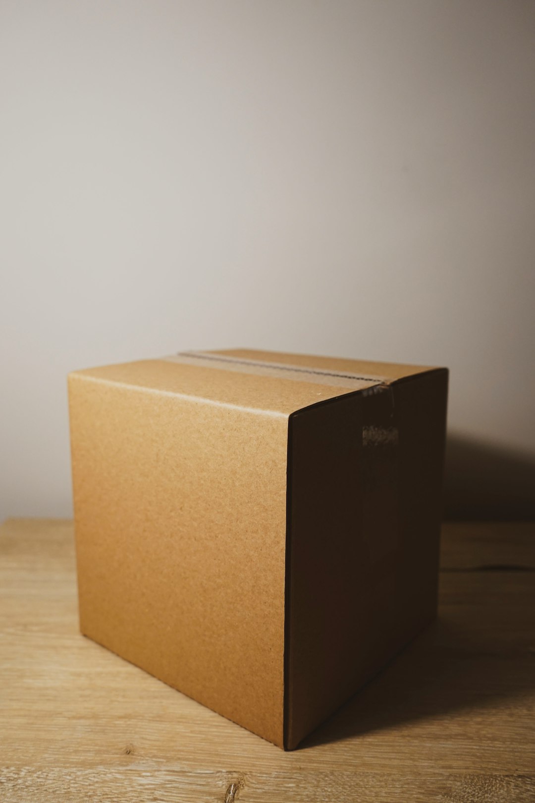 Cardboard shipping box, illustrating parcel and courier delivery.