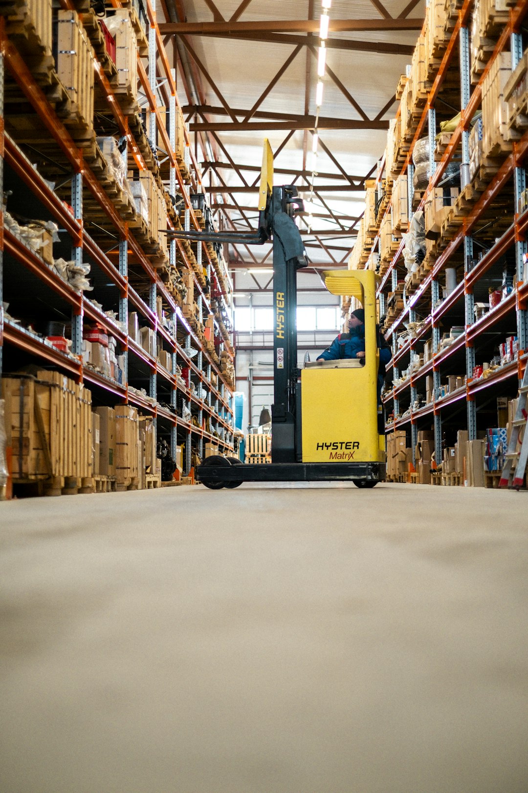 Forklift in a warehouse, illustrating collection of an auction purchase.