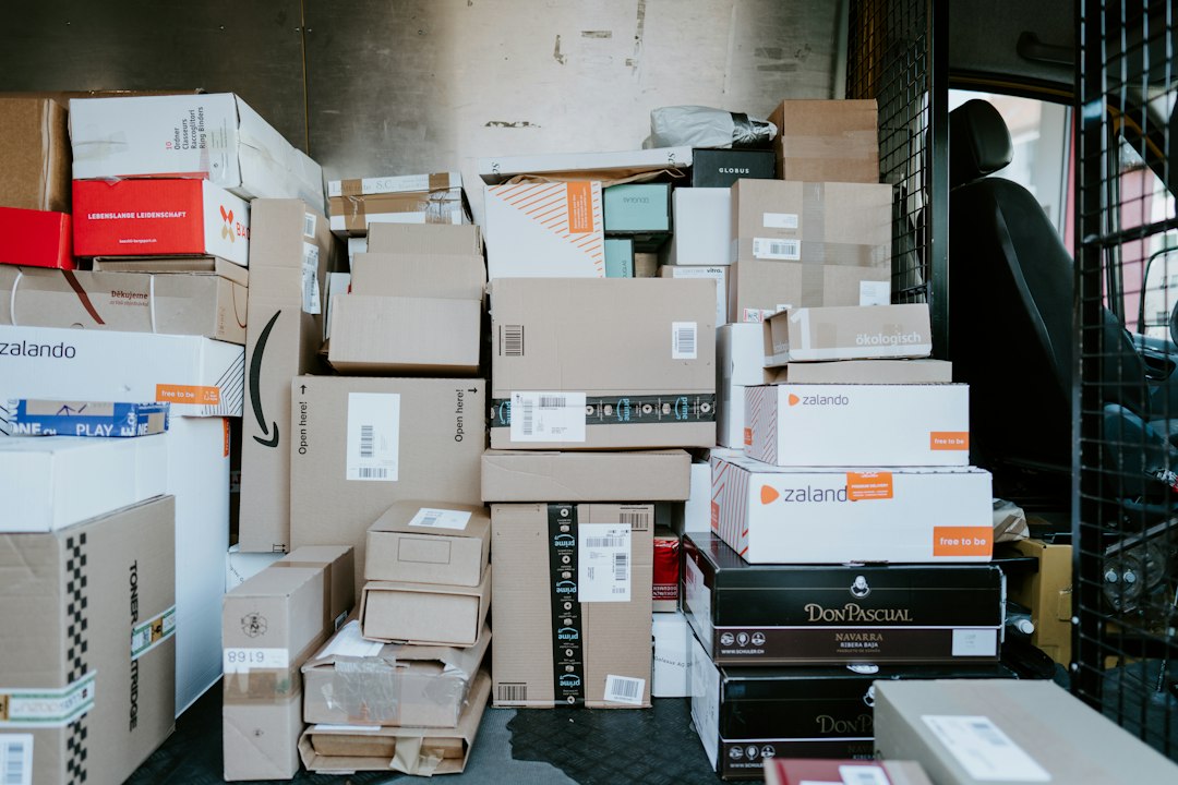 Shipping boxes inside a delivery van, illustrating equipment and business courier transport.